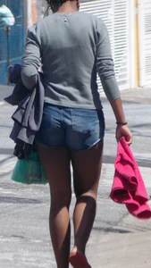 Black booty in denim shorts with slight vpl