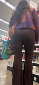 Brunette in maroon flare leggings