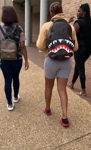 Friends in spandex grey bike shorts and tight jeans