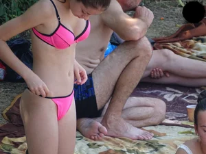 Beautiful and sexy teen in pink thong bikini