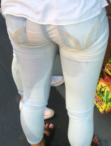 Girl in wet jeans making them semi see through