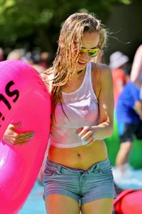 Tubing hottie in shorts and a wet white shirt