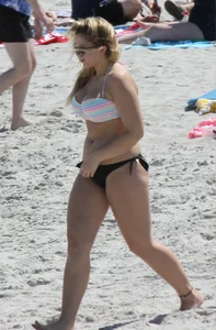 Big boobed thick blonde on the beach in a bikini