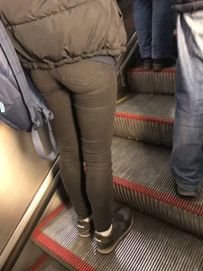 Booty in Tight Black Jeans on the Escalator Closeup Candid Photo