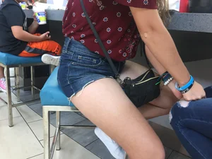 Girl in Denim Shorts Sitting on a Stool With Spread Legs Food Court Creepshots