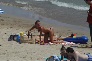 Girls on a nude beach in Sitges, Spain