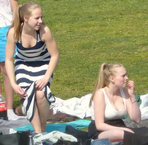Teen taking off her dress in the park