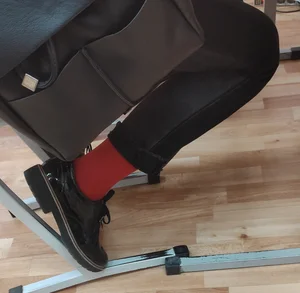 Closeups of a Candid College Teen's Legs in Pants, Shoes And Red Socks - Sitting at Her Desk in Class