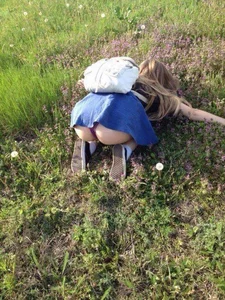 Girl in a Skirt Lying on Grass