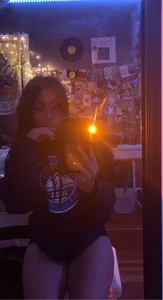 Nice Girl in a Hoodie And Panties Standing on Knees And Taking a Mirror Selfie in Her Room