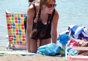 Lady with nice tits in a white bikini on the beach