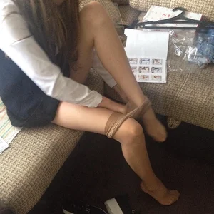 Skinny Girl Taking Off Her Pantyhose Photo