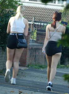 Pair of oblivious teens in short shorts