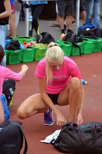Sexy blonde track sprinter changing after a race