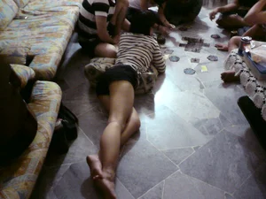 Candid teen in shorts laying on the floor