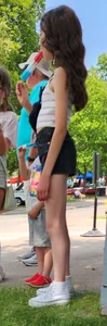 girl sucking on ice cream