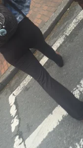 Girl with a nice ass in leggings walking down the street