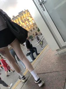 A Tall And Slim Candid Girl in Spandex Shorts in a Hoodie Top, With Tattoos on Her Long Legs Subway Creepshots