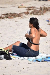 Thick mature brunette bikini lady on the beach with a nice body