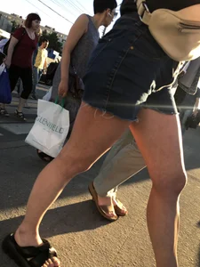 Cute candid teen wearing denim shorts crossing the street, awesome muscly legs