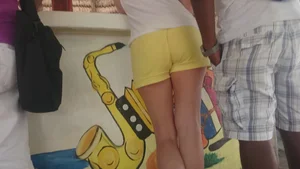 Milf in yellow shorts with vpl and a wedgie