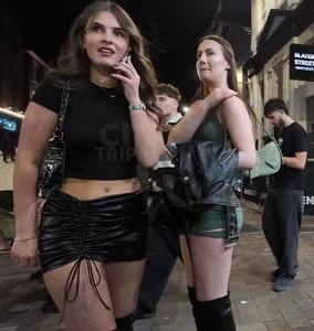 Very pretty girl in short leather skirt and high boots (not OC)
