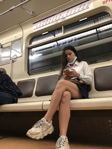 Girl in a Blouse And a Skirt With Great Legs Creepshots Gallery - Standing on the Subway Station, then Sitting With Crossed Legs in a Train