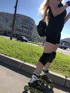 Fit Girl in Spandex Shorts And Knee Pads on Roller Blades Street Creepshots