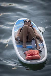 Brunette in thong bikini shows ass, crotch, boobs, and feet