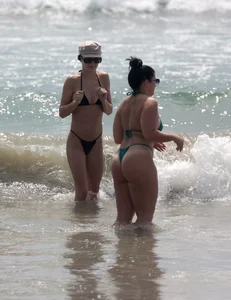 Thick and skinny friends on the beach in thongs