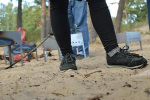 Sneakers And Skinny Jeans Closeup - Girl Standing on Sand in a Nature Park