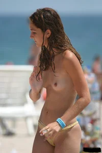 Beach voyeur girls in bikinis, thongs and topless