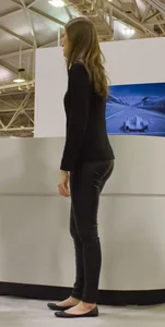 Pretty car saleswoman in tight shiny black pants with nice ass