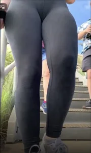 Teen in leggings walking down stairs with slight camel toe and busted