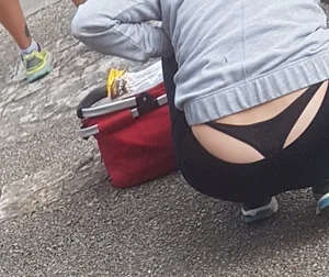 Short haired milf sitting showing her thong