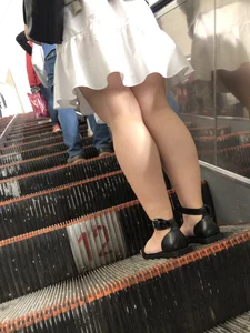 Stocky Legs of a Girl in a Dress And Feet in Sandals Subway Escalator Creepshots