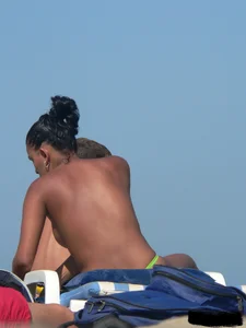 Hot ass topless beach girl with great tits lets her little brother oil up her ass in thong bikini