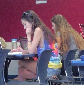 College girl in class showing sideboob with no bra on