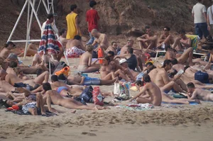 Topless girls on a beach in Barcelona