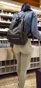Beautiful brunette shopping in tight grey spandex with a great ass