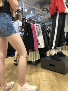 Girl with Amazing Hot Legs in Denim Shorts in a Store Candid