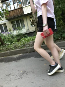Couple of candid teens walking down the street
