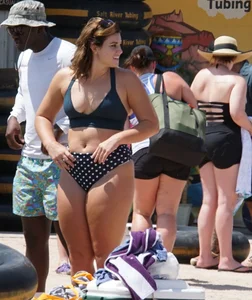 Girls in bikinis getting ready for tubing
