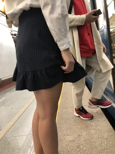 Girl in a Blouse And a Skirt With Great Legs Creepshots Gallery - Standing on the Subway Station, then Sitting With Crossed Legs in a Train