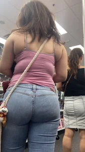 Thick Latina with a sweet ass in pocketless jeans w/slight VTL
