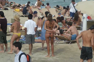 Topless girls on a beach in Barcelona