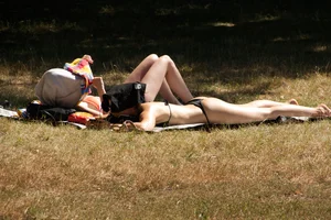 Creepshots of some girls in the park getting some sun in bikinis
