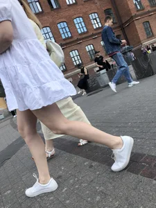 Young candid girl in a white dress, hot legs