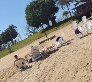 Blonde beach girl with a great ass in pink thong bikini