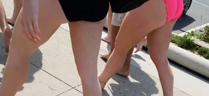 Cute brunette looking sexy in black bikini with friends